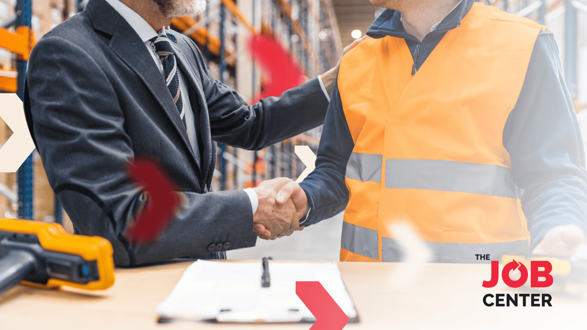 Logistics worker shakes hands with a manager after securing a stable job